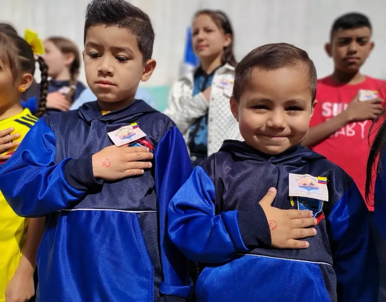 Two boys pledging allegiance