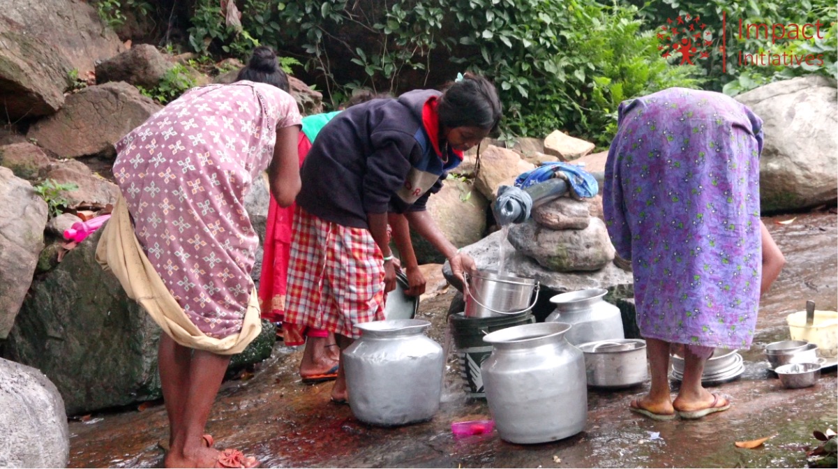 School girls enjoying fresh water from their new well